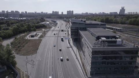 Drone Moving along Moscow Highway Past Office