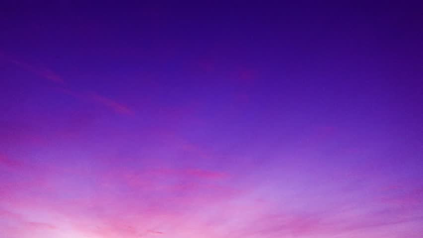 Sunrise or sunset magenta purple sky background with colorful red pink clouds or Contrail n condensation trail cloudscape in tropical summer or spring sunlight at sunny day, 4k stop motion TimeLapse