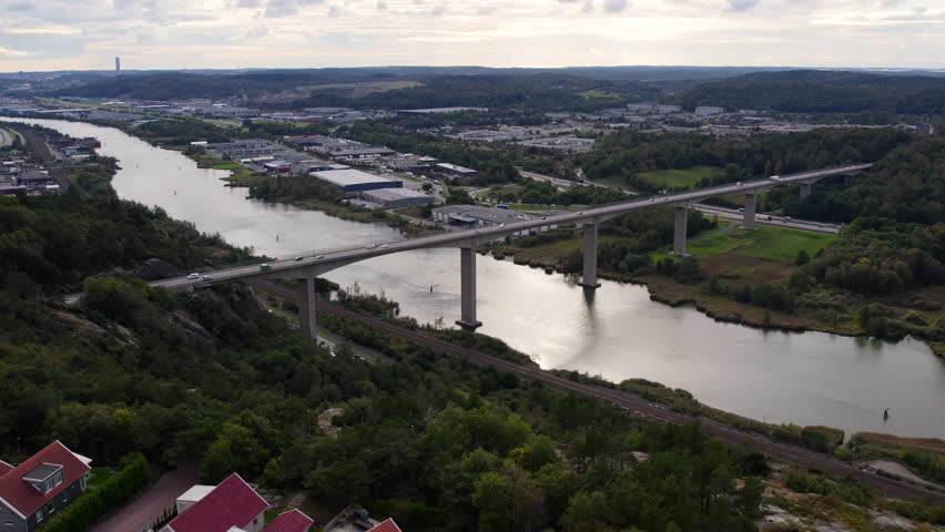 View of Angeredsbron bridge crossing lush landscape in Gothenburg, Sweden