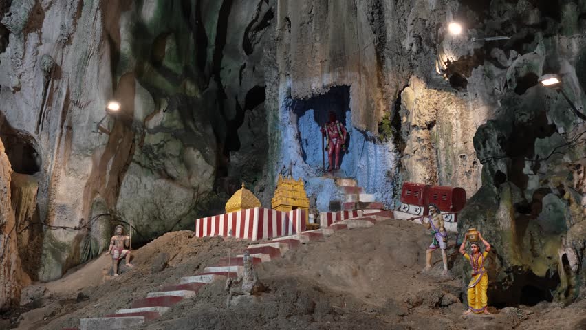 Colorful statues inside Batu Caves, Kuala Lumpur, showcasing Hindu culture