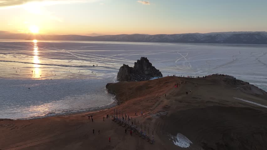 Beautiful blue ice of Lake Baikal in winter, Siberia, Russia. Shamanka rock. Khuzhir