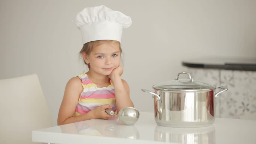 Girl cook with a saucepan and ladle
