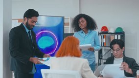Indian businessman and multicultural team analyzing AI brain visualization and digital data during a strategic corporate presentation. - Powered by Shutterstock - Get 15% off with code: PIKWIZARD15