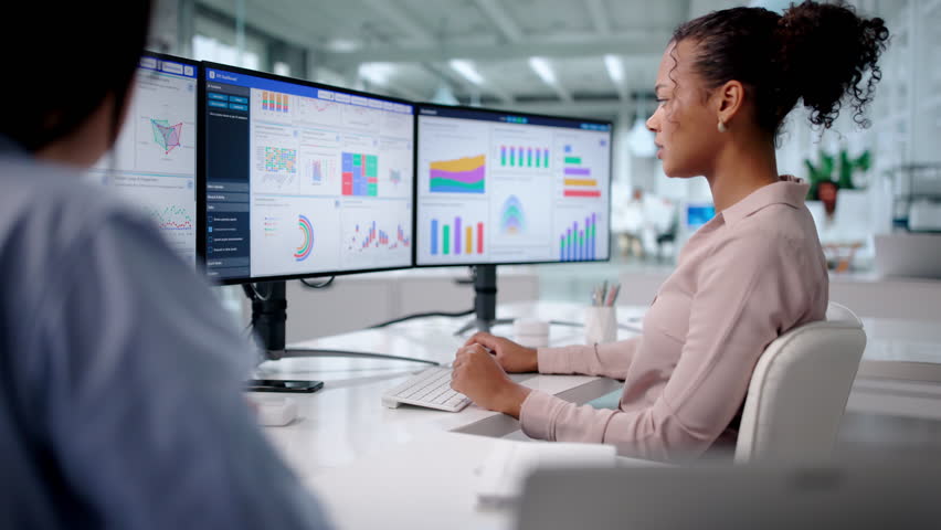 Business Coach Analyzing Data On Computer Dashboard In Corporate Office.