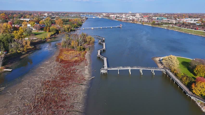 Saginaw River boardwalk spanning water, Bigelow Park, Bay City, Michigan in aerial view