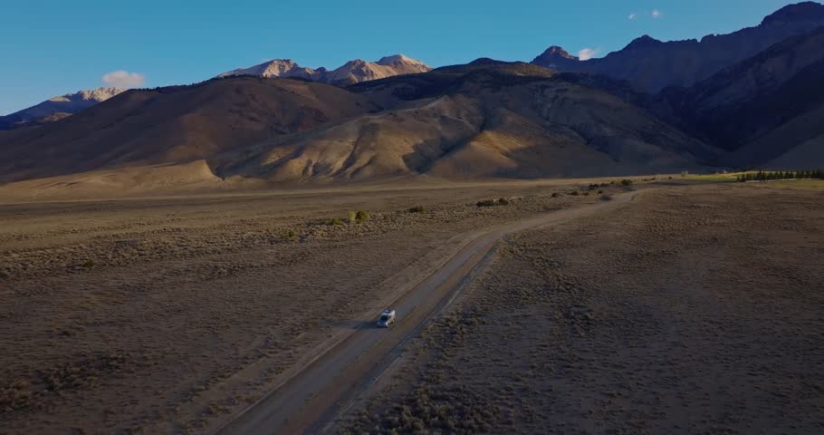 Straight stretch of Highway 93 leading toward Borah Peak in Idaho valley