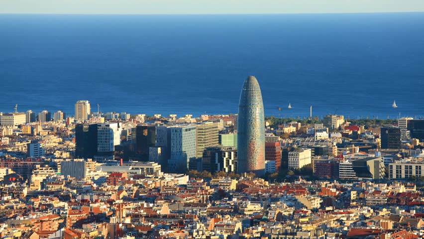 Pan shot aerial view of Parc 22 cityscape at sunset, Torre Agbar, Barcelona, Spain