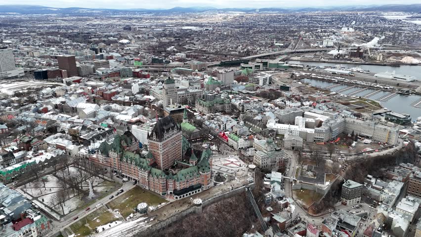 Aerial view of Quebec City Canada in winter with snow covered rooftops and frozen river, Chateau Frontenac, Canada