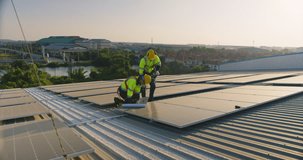 Two professional engineers inspect solar panel equipment on an industrial rooftop, focusing on renewable energy efficiency, sustainability, and quality control. - Powered by Shutterstock - Get 15% off with code: PIKWIZARD15