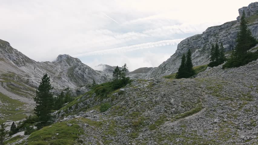 Mountain tourism in Rhone Alpes France showing an aerial view of a rugged landscape with rocky