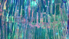 Iridescent tinsel streamers creating a sparkling holographic rainbow background texture - Powered by Shutterstock - Get 15% off with code: PIKWIZARD15