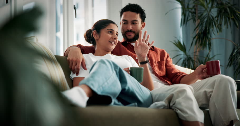 Relax, couple and coffee toast on sofa for marriage goals, bonding together and conversation. Love, people and happy with beverage cheers in home for relationship milestone, weekend break and support