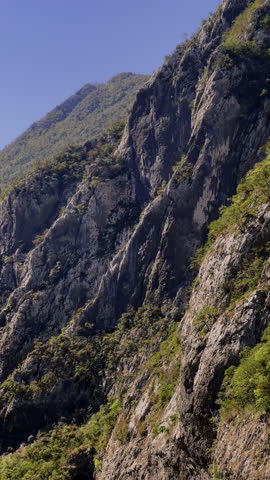 Montenegro, picturesque scenery of a mountain range with a mountain river on a sunny day, a mountain range in the background