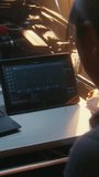 Woman Uses Dual Screen Setup, Featuring Laptop and Tablet, Monitor Complex Engine Performance Graphs, Sensor Logs Simultaneously. Software Driven Car Maintenance, Technical Expertise. Vertical Shot. - Powered by Shutterstock - Get 15% off with code: PIKWIZARD15