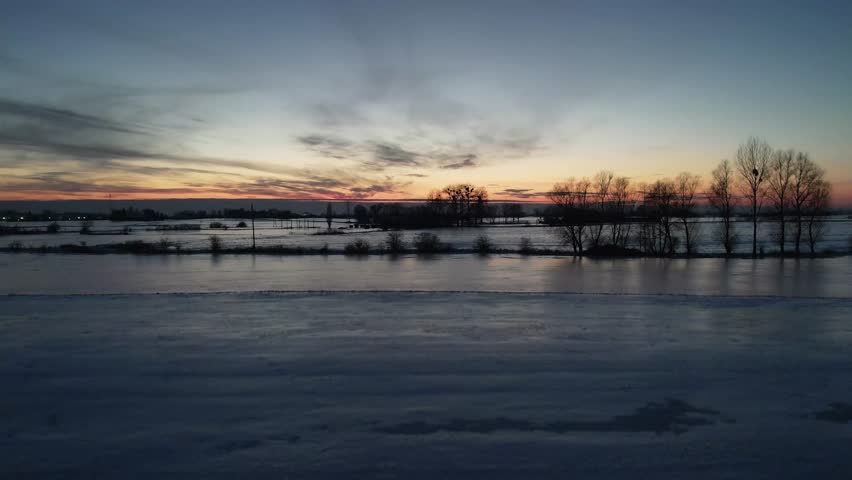 Winter Sunset Over Snowy Landscape
