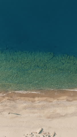 Sea and Empty Beach of Roccella Ionica city in Calabria Italy aerial overhead