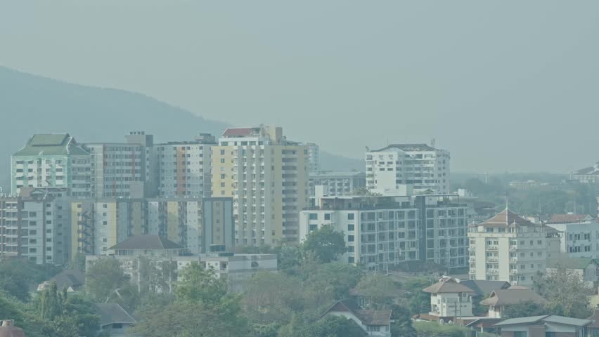 The city landscape was shrouded in smog and dust as air pollution spread throughout the city, reducing visibility and highlighting environmental problems.