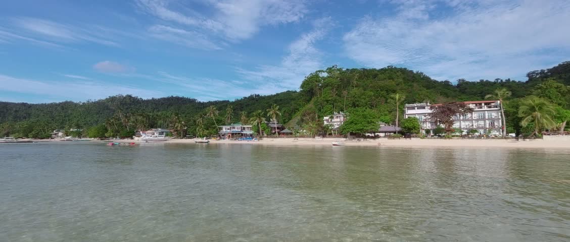 Tropical Beach With White Sand And Clear Turquoise Water on Palawan Island Philippines