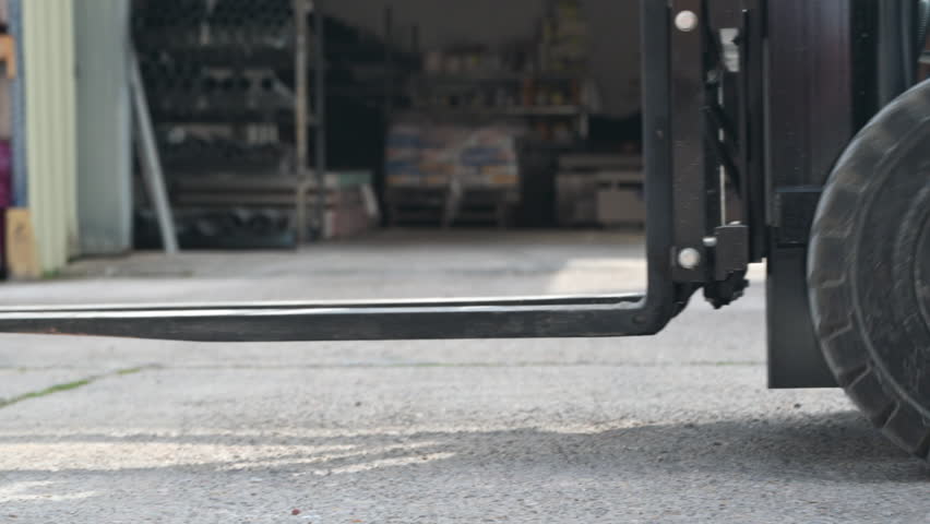 Forklift moving in warehouse logistics tracking shot industrial transport. High quality 4k footage