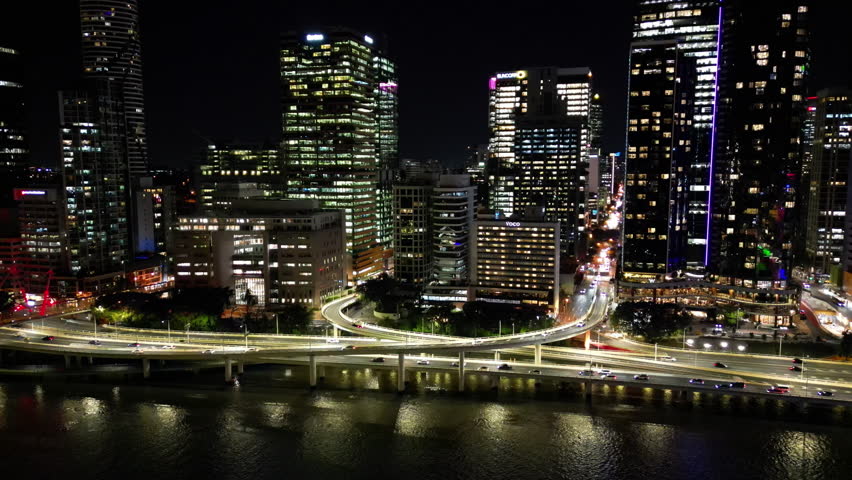 Aerial view of night cityscape of Brisbane Australia. Car lights and skyscrapers in a beautiful urban landscape.