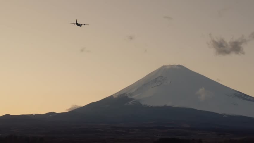 Soldiers conduct an air operation at the foot of the snowy mountains.
