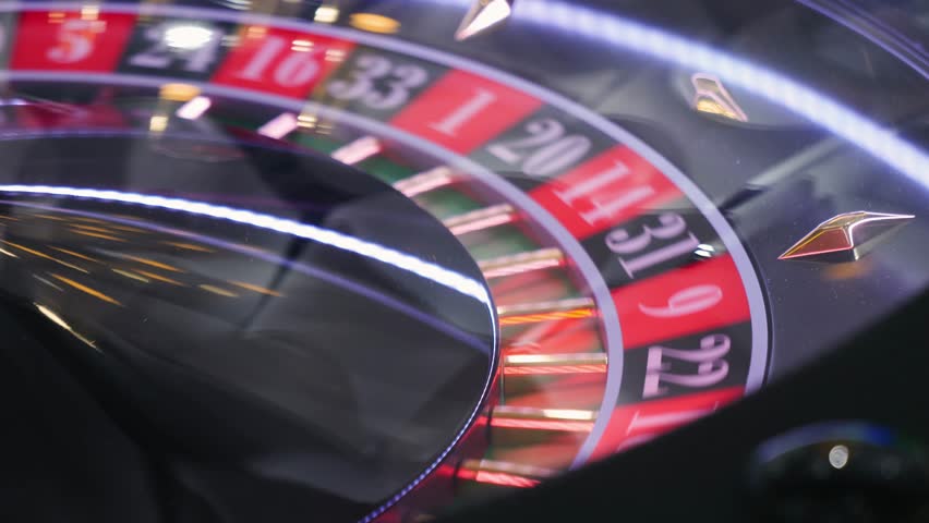 Roulette Wheel Close-up Casino Game with Ball and Numbers, man playing game, gambling and betting. 