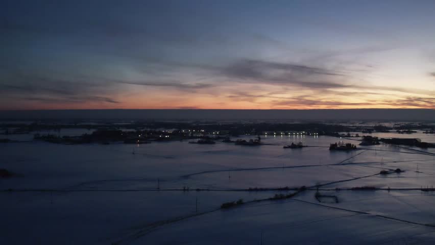 Winter Sunset Over Snowy Landscape