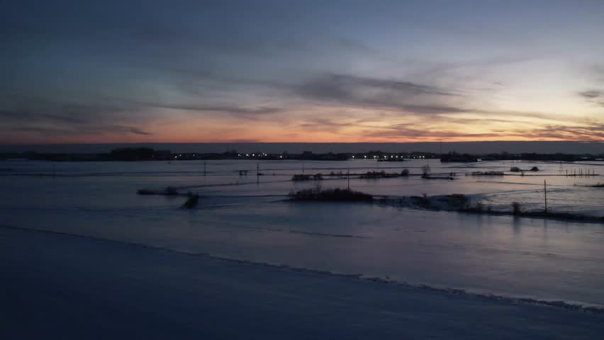 Winter Sunset Over Snowy Landscape