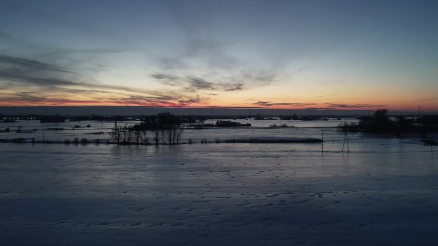 Winter Sunset Over Snowy Landscape