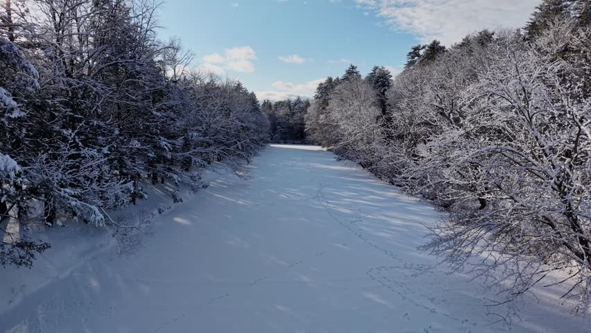 Winter aerial view featuring the Lamprey River upstream of Wadleigh Falls in Lee, New Hampshire
