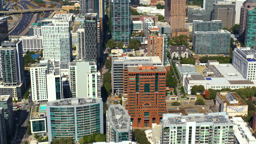 Atlanta, Georgia skyline with prominent skyscraper buildings and roads stretching across the city. Modern urban infrastructure.