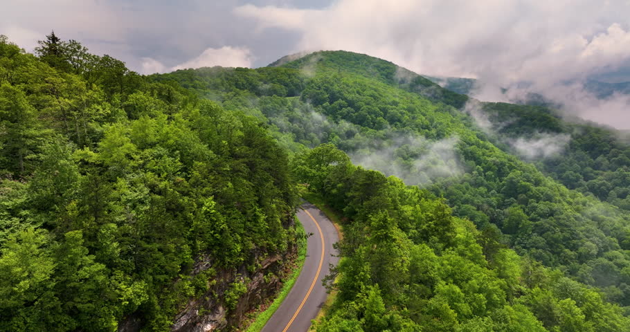 Blue Ridge Parkway road trip. Driving car exploration travel in summer forest on Appalachian mountain hills in North Carolina. Summertime landscape of beautiful nature.