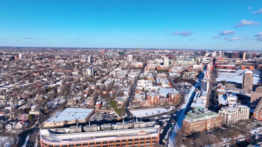 Aerial view of Cambridge on the left and Boston Back Bay on the right connected by Harvard Bridge across Charles River in winter, Boston, Massachusetts MA, USA. 