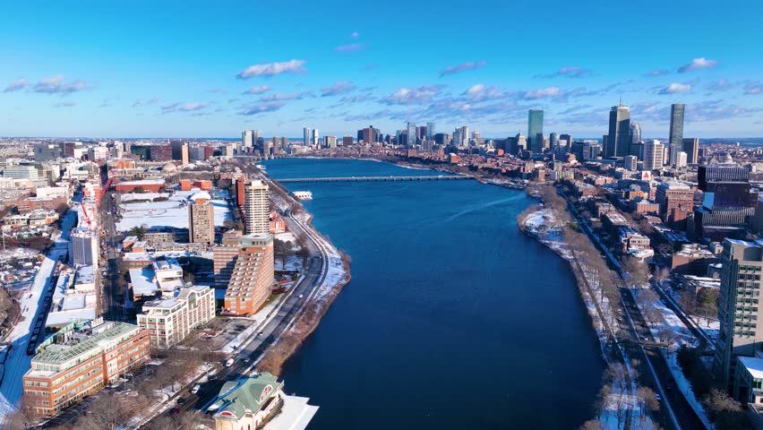 Aerial view of Cambridge on the left and Boston Back Bay on the right connected by Harvard Bridge across Charles River in winter, Boston, Massachusetts MA, USA. 