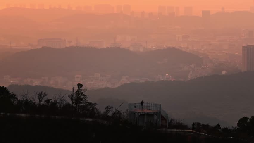 sunset over the mountains Amazing Orange Sunset Through Clouds Over China Mountains