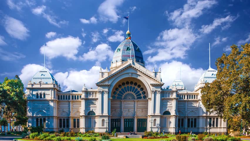 Melbourne, Australia,: People wondering around Royal exhibition center building in MelbourneMELBOURNE, AU - Nov 25, 2015: A majestic fountain stands in front of the Royal Exhibition Building in Melbourne, Australia 