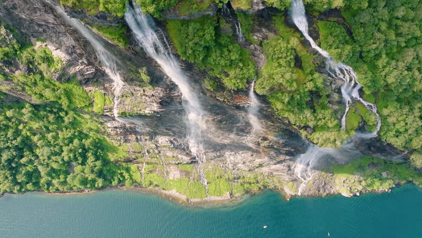 Seven Sisters Waterfall, Geiranger Fjord, Norway. Nature in fjords. Traveling through the Norwegian fjords. Scandinavia. View of nature from the drone. Vacation and travel in summer Norway.
