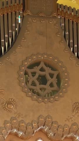 Vertical editorial shot of a ceremonial Star of David embroidery at the Novi Sad Synagogue.