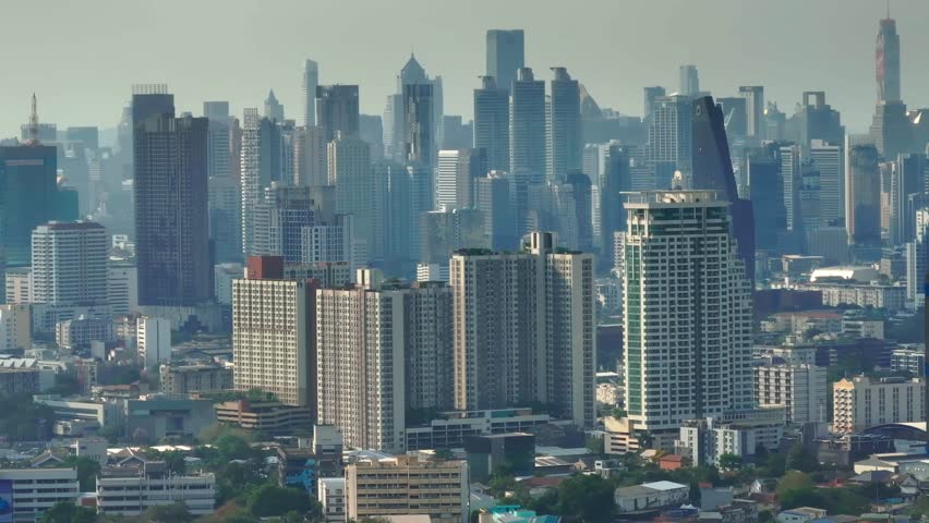 Aerial view of modern Bangkok skyline filled with skyscrapers and high-rises