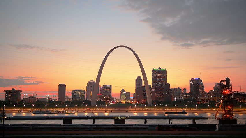 St. Louis, Missouri, USA downtown cityscape on the Mississippi River at sunset.