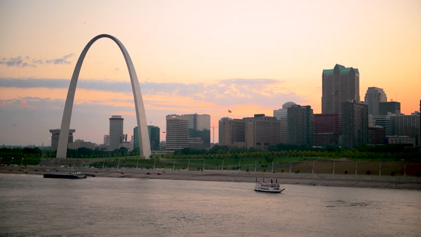 St. Louis, Missouri, USA downtown cityscape on the Mississippi River at sunset.