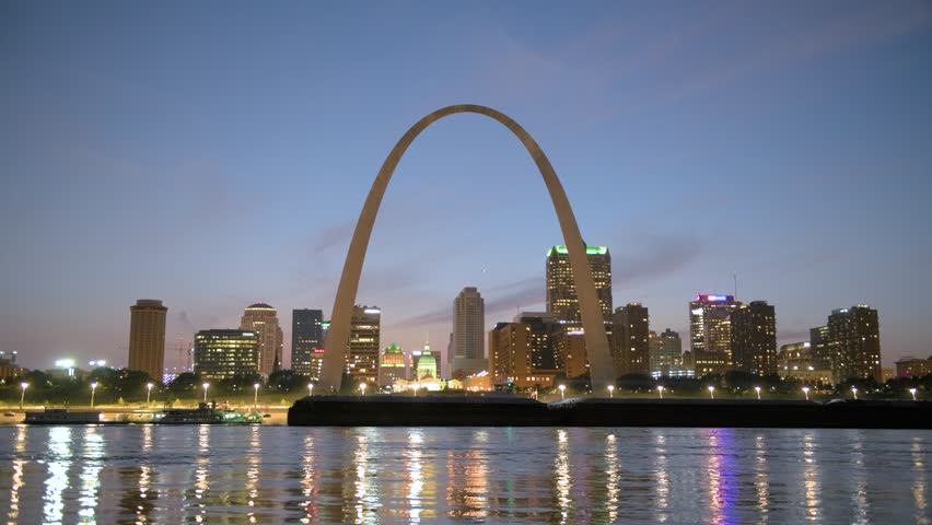St. Louis, Missouri, USA downtown cityscape on the Mississippi River at sunset.