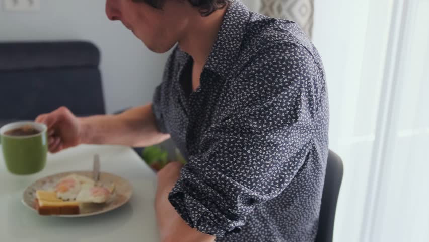 Family breakfast gathering, Morning meal enjoyed by family members together, Joyful family breakfast with parents and kids present, Family members gather in morning to share meal under bright sunlight