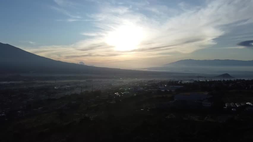 sunrise behind the mountains indonesia