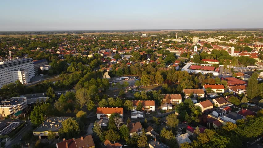 Kiskunhalas, Hungary, overview of a populated area with activity in a central green space