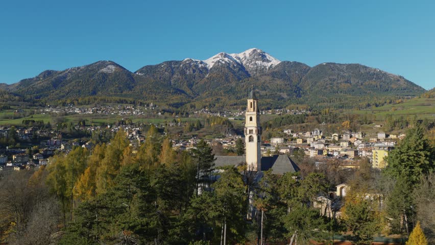 Church Of S. Maria Assunta Bell Tower In Cavalese Within Val di Fiemme Region In Italy. Aerial Shot