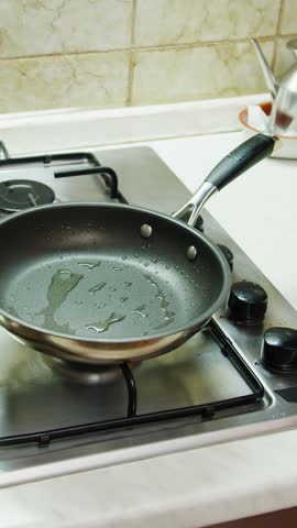 Cooking a savory omelette, a typical Sicilian dish, in an Italian kitchen