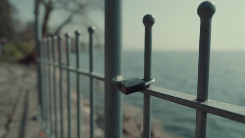 Love Lock on a Fence by the Water