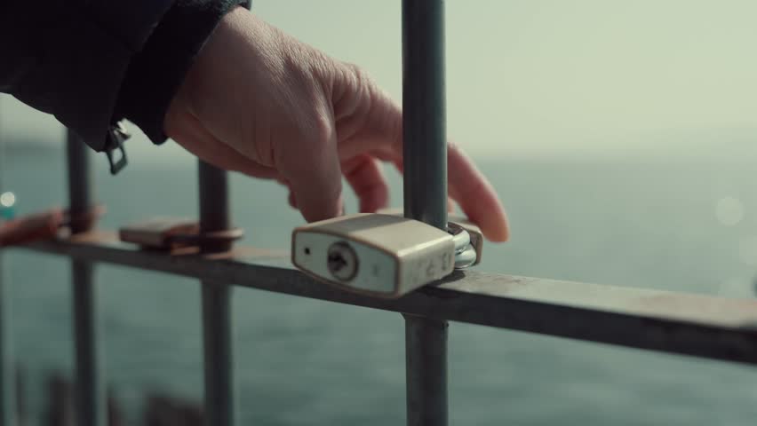 Love Lock on a Fence by the Water