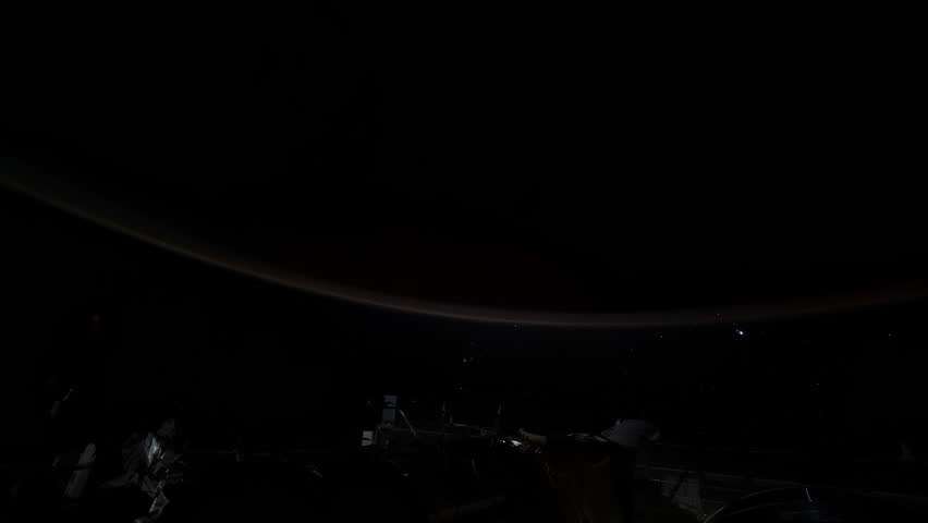 ISS Modules Illuminated By Sunrise Earth Rotation Slow Motion. Source material provided by NASA.